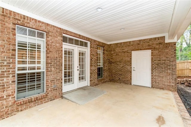 view of patio / terrace with french doors and fence