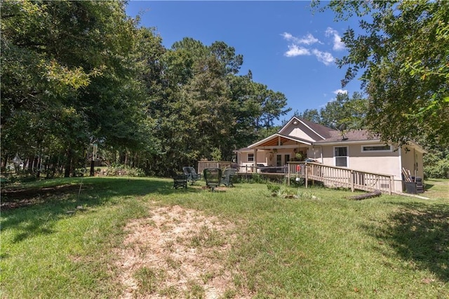 view of yard with a wooden deck