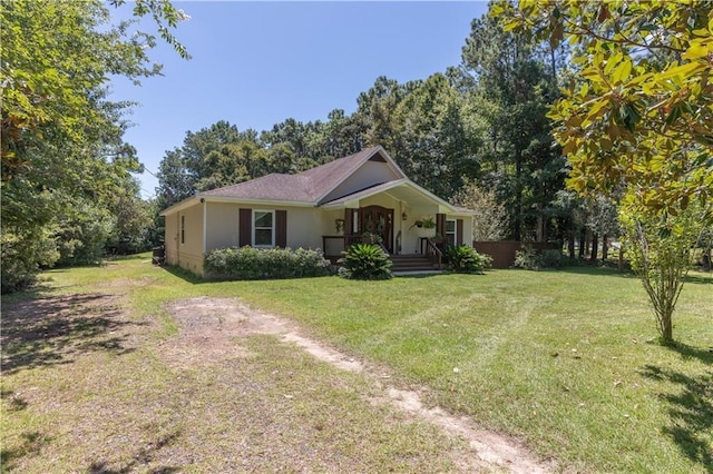 view of front facade with covered porch and a front lawn