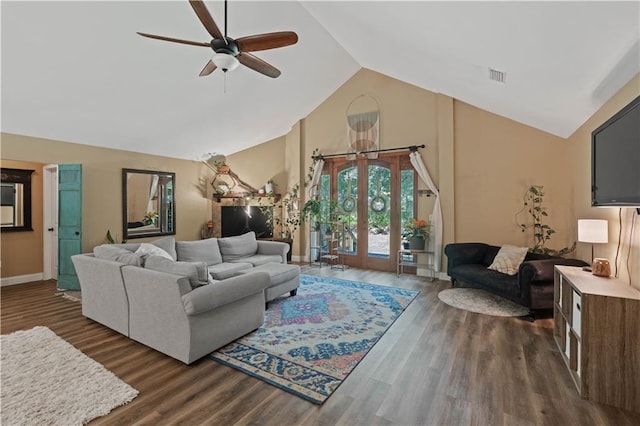 living room with dark hardwood / wood-style flooring, ceiling fan, high vaulted ceiling, and french doors