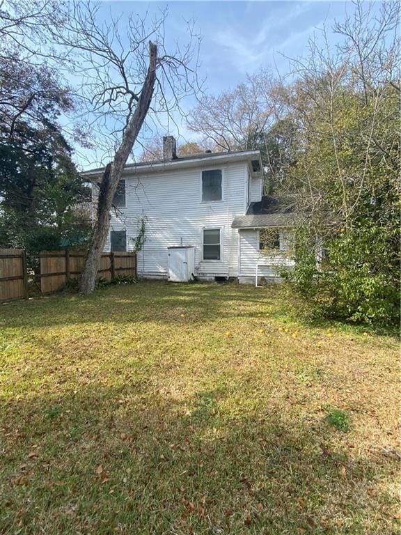 1902 Calmes St, Mobile, AL 36606 - rear view of house featuring a chimney