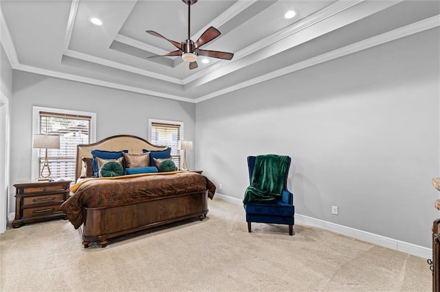 bedroom with crown molding, ceiling fan, a raised ceiling, and light carpet