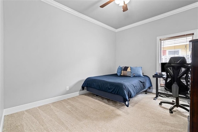 carpeted bedroom featuring ornamental molding and ceiling fan