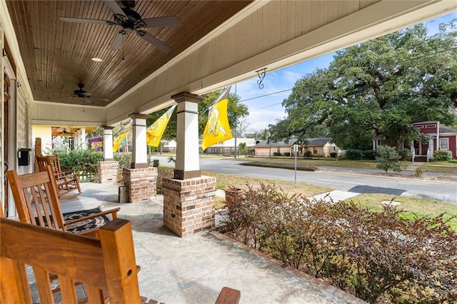 view of patio featuring ceiling fan and a porch