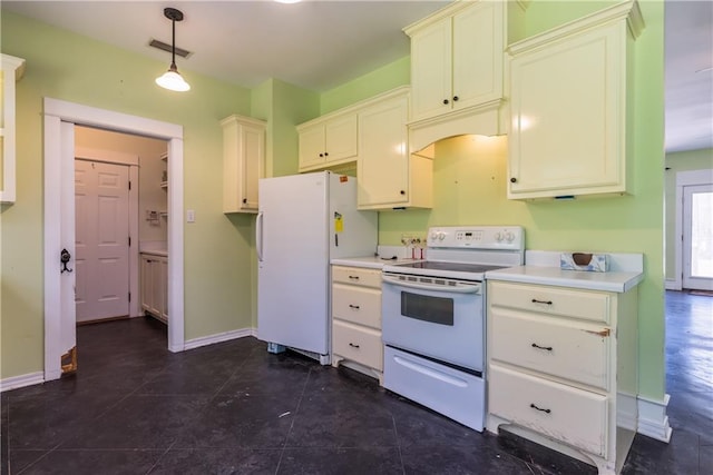 510 Fort Mims Pl, Dauphin Island, AL 36528 - kitchen featuring light countertops, baseboards, white appliances, and decorative light fixtures