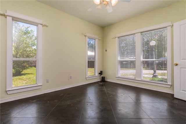 510 Fort Mims Pl, Dauphin Island, AL 36528 - spare room featuring baseboards, a ceiling fan, and a healthy amount of sunlight