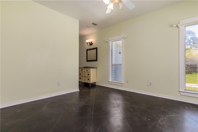 510 Fort Mims Pl, Dauphin Island, AL 36528 - unfurnished room featuring dark tile patterned flooring, baseboards, a ceiling fan, and visible vents