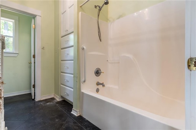 510 Fort Mims Pl, Dauphin Island, AL 36528 - bathroom with washtub / shower combination, baseboards, and tile patterned flooring