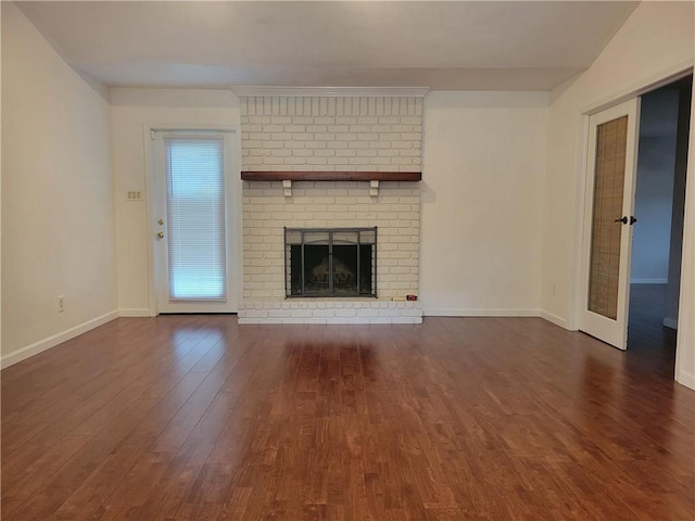 2544 Buckboard Ct, Mobile, AL 36695 - unfurnished living room featuring dark wood-style flooring, baseboards, and a fireplace