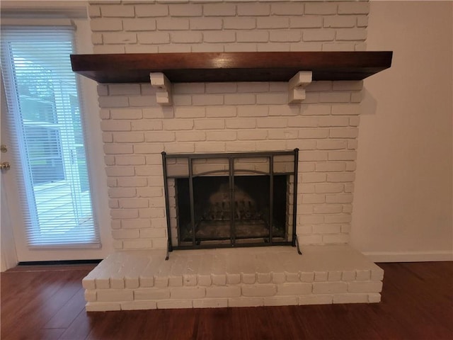 2544 Buckboard Ct, Mobile, AL 36695 - detailed view of wood finished floors, a fireplace, and baseboards