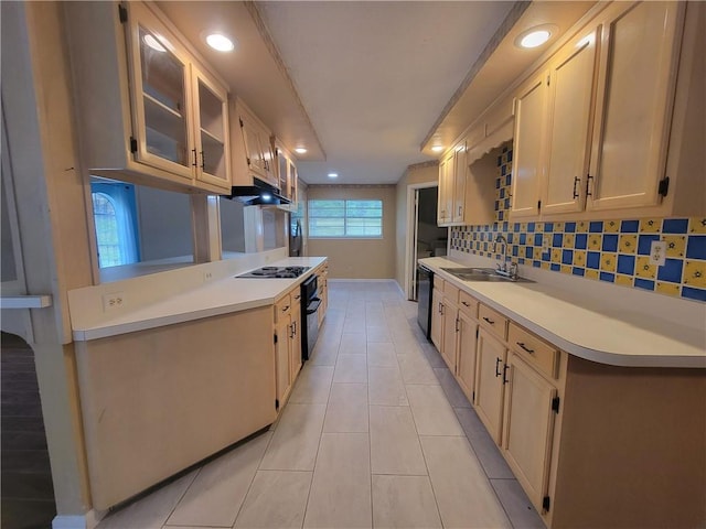 2544 Buckboard Ct, Mobile, AL 36695 - kitchen featuring a sink, light countertops, black appliances, glass insert cabinets, and under cabinet range hood