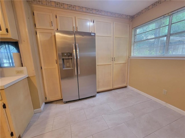 2544 Buckboard Ct, Mobile, AL 36695 - kitchen featuring stainless steel fridge with ice dispenser, baseboards, light countertops, and light tile patterned floors