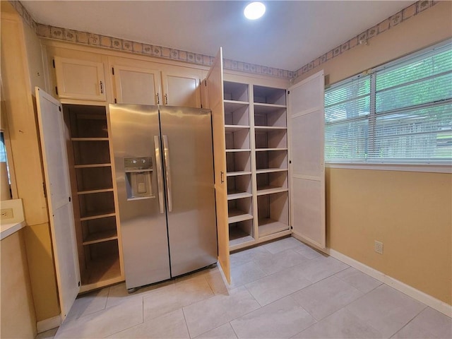 2544 Buckboard Ct, Mobile, AL 36695 - kitchen featuring stainless steel fridge, baseboards, light tile patterned floors, and open shelves