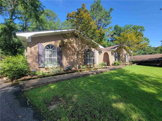 2544 Buckboard Ct, Mobile, AL 36695 - ranch-style home with brick siding and a front yard