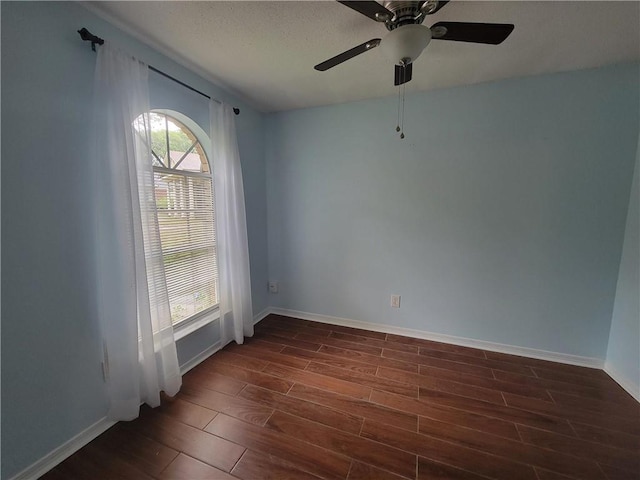 2544 Buckboard Ct, Mobile, AL 36695 - empty room featuring dark wood-style flooring, baseboards, and ceiling fan