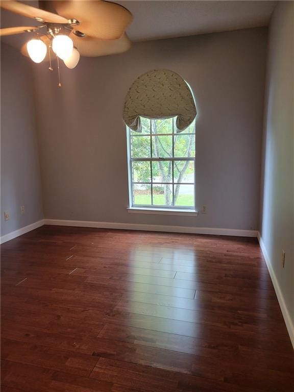 2544 Buckboard Ct, Mobile, AL 36695 - spare room with dark wood-type flooring, a ceiling fan, and baseboards