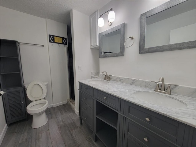 2544 Buckboard Ct, Mobile, AL 36695 - full bath featuring toilet, double vanity, wood finished floors, baseboards, and a stall shower