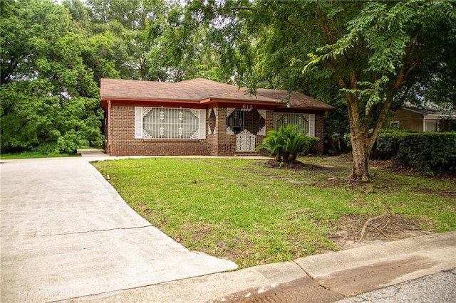 612 Summerland Dr, Mobile, AL 36617 - view of front of property with a front yard, brick siding, driveway, and covered porch