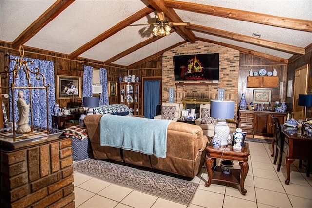 612 Summerland Dr, Mobile, AL 36617 - tiled living room featuring wood walls, a textured ceiling, and ceiling fan