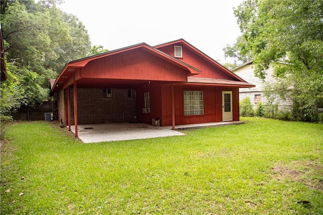 612 Summerland Dr, Mobile, AL 36617 - back of property with an attached carport, cooling unit, and a patio area