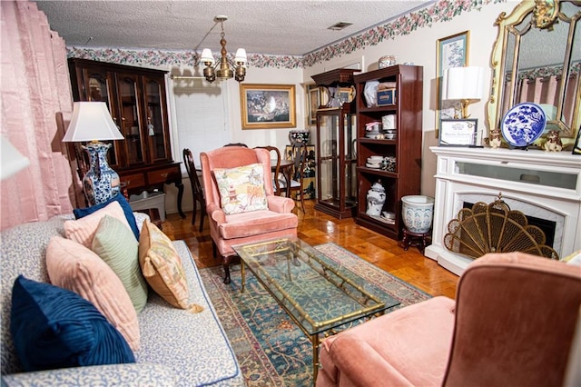 612 Summerland Dr, Mobile, AL 36617 - living area with a chandelier and a textured ceiling
