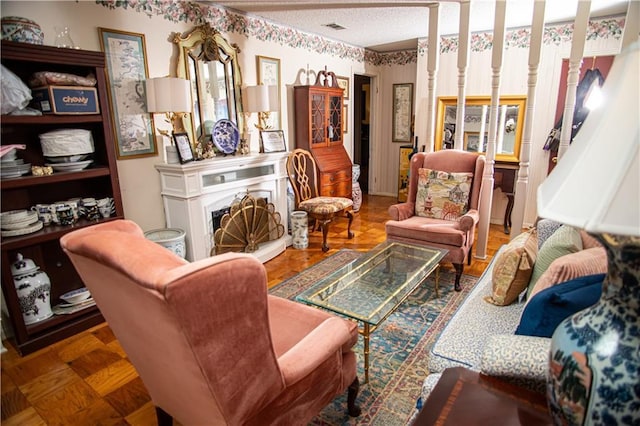 612 Summerland Dr, Mobile, AL 36617 - living area featuring a fireplace with raised hearth and a textured ceiling