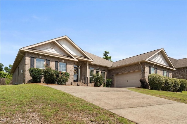 2151 Elliott Ct, Mobile, AL 36695 - craftsman-style home featuring brick siding, an attached garage, concrete driveway, and a front lawn