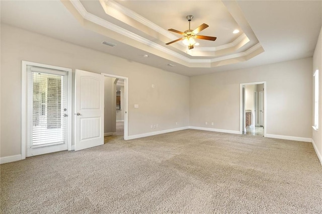 2151 Elliott Ct, Mobile, AL 36695 - unfurnished bedroom featuring ornamental molding, a tray ceiling, carpet floors, baseboards, and access to exterior