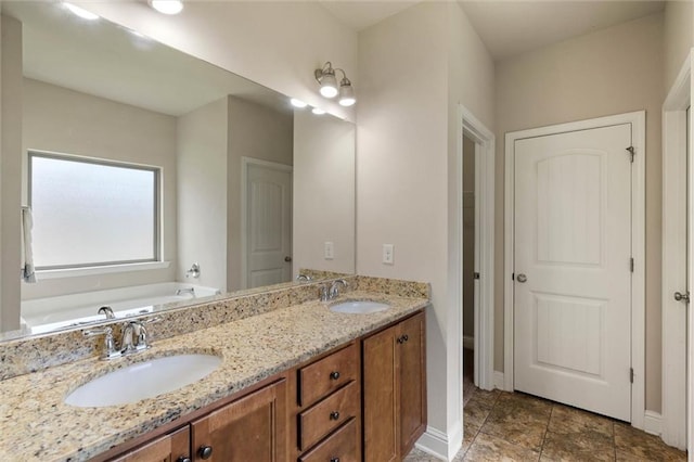 2151 Elliott Ct, Mobile, AL 36695 - full bathroom featuring a bath, double vanity, and baseboards