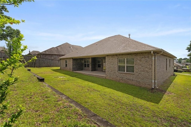 2151 Elliott Ct, Mobile, AL 36695 - back of house with a patio area, brick siding, and a shingled roof