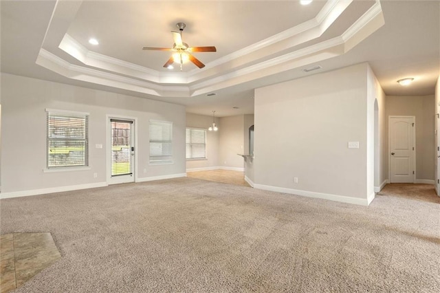 2151 Elliott Ct, Mobile, AL 36695 - spare room featuring a tray ceiling, a ceiling fan, light carpet, crown molding, and baseboards