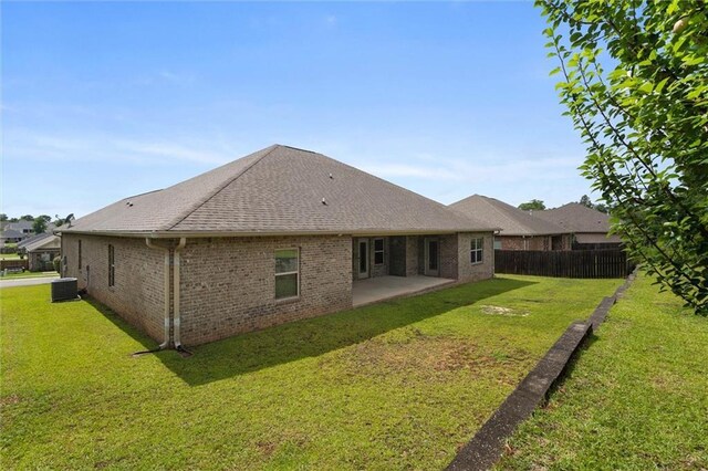 2151 Elliott Ct, Mobile, AL 36695 - back of house featuring a patio area, cooling unit, brick siding, and roof with shingles