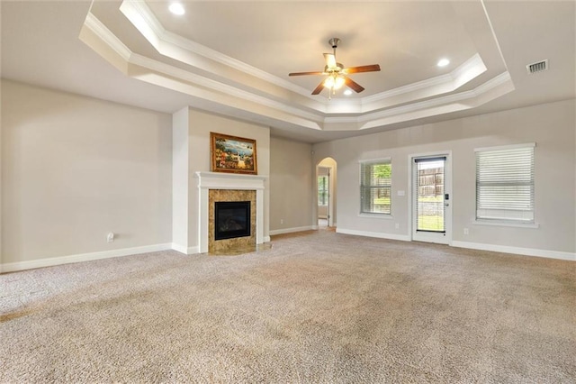 2151 Elliott Ct, Mobile, AL 36695 - unfurnished living room featuring a raised ceiling, ornamental molding, a ceiling fan, carpet, and a tile fireplace