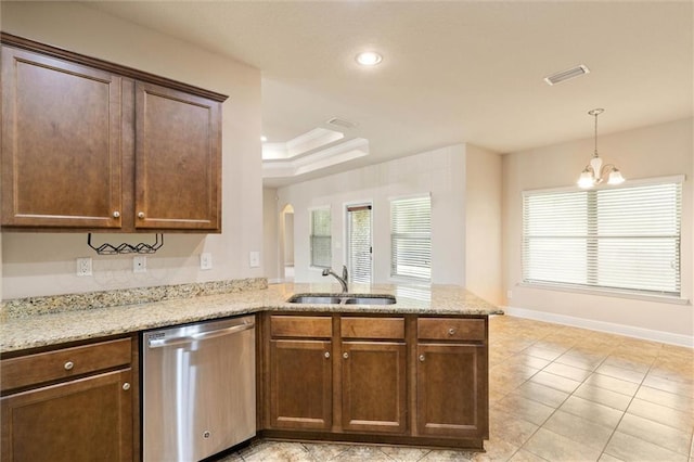 2151 Elliott Ct, Mobile, AL 36695 - kitchen featuring stainless steel dishwasher, a sink, a peninsula, arched walkways, and light stone countertops