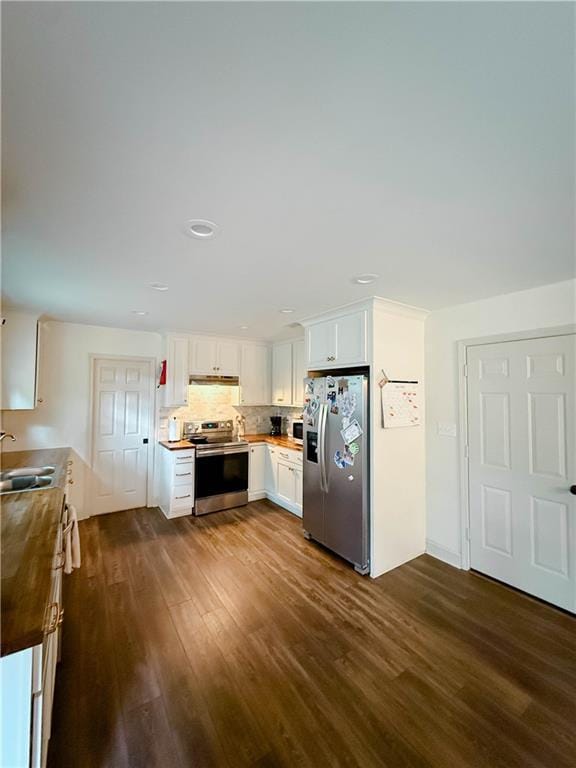 2555 E Rd, Mobile, AL 36693 - kitchen with stainless steel appliances, dark wood-style flooring, a sink, under cabinet range hood, and white cabinets