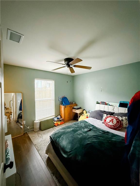2555 E Rd, Mobile, AL 36693 - bedroom featuring wood-type flooring and ceiling fan