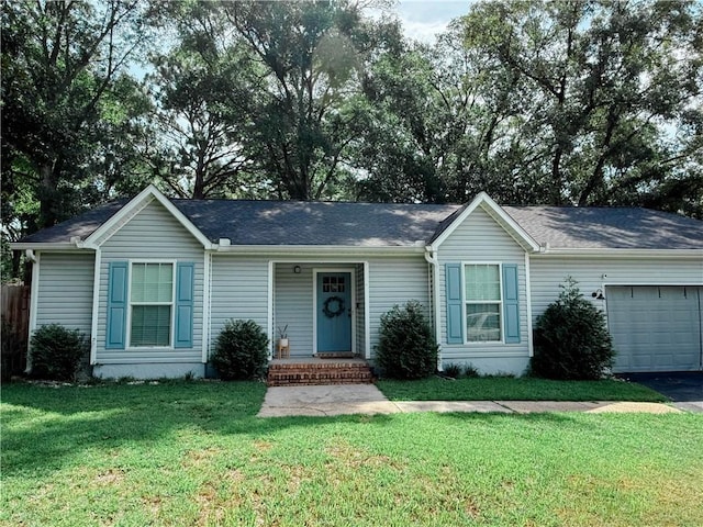 2555 E Rd, Mobile, AL 36693 - ranch-style home featuring an attached garage, a front lawn, and asphalt driveway