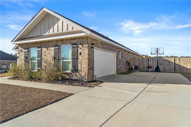 view of side of home featuring a garage