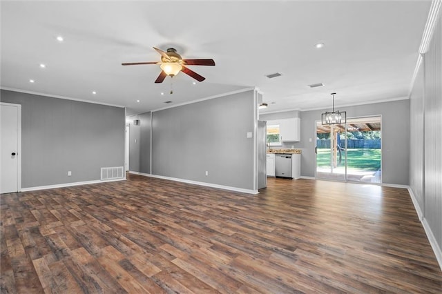 unfurnished living room featuring ceiling fan with notable chandelier, dark hardwood / wood-style flooring, and ornamental molding