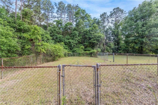 view of yard with a gate and fence