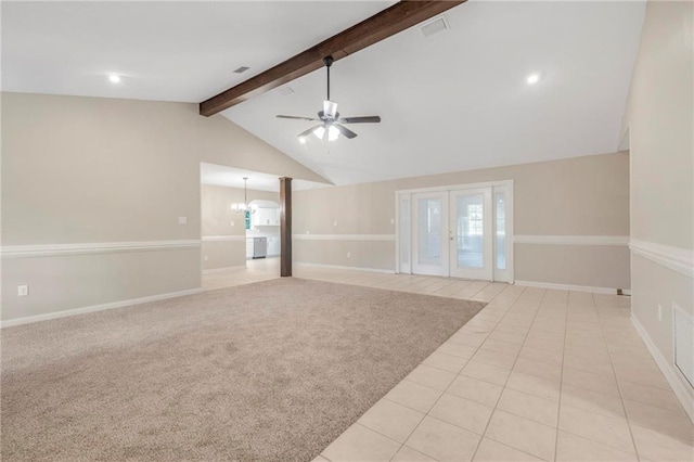 unfurnished room with visible vents, baseboards, lofted ceiling with beams, ceiling fan with notable chandelier, and light tile patterned flooring