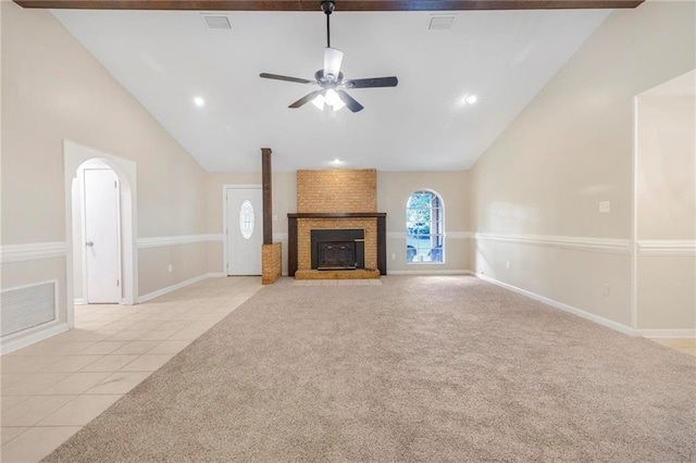 unfurnished living room with a ceiling fan, high vaulted ceiling, visible vents, and light tile patterned floors