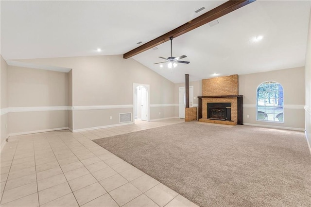 unfurnished living room featuring vaulted ceiling with beams, baseboards, ceiling fan, and light tile patterned floors
