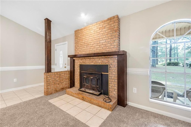 unfurnished living room featuring baseboards, light colored carpet, and lofted ceiling