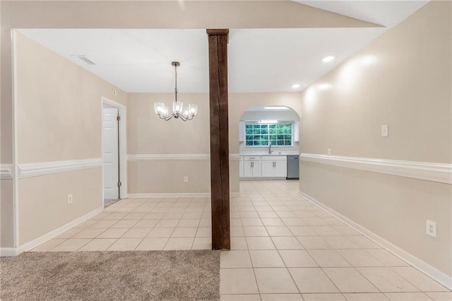 unfurnished dining area featuring visible vents, light tile patterned floors, a sink, an inviting chandelier, and recessed lighting