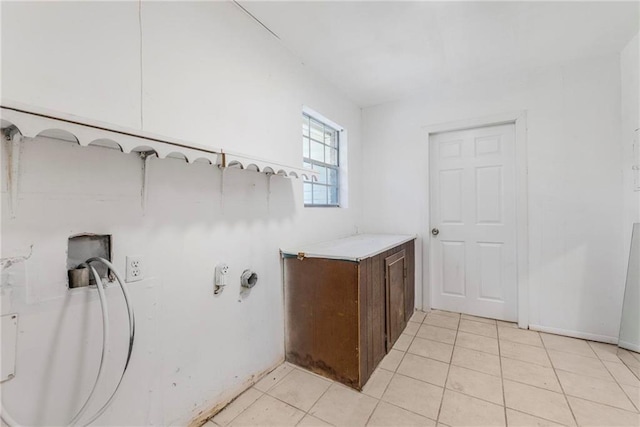 laundry room with light tile patterned floors
