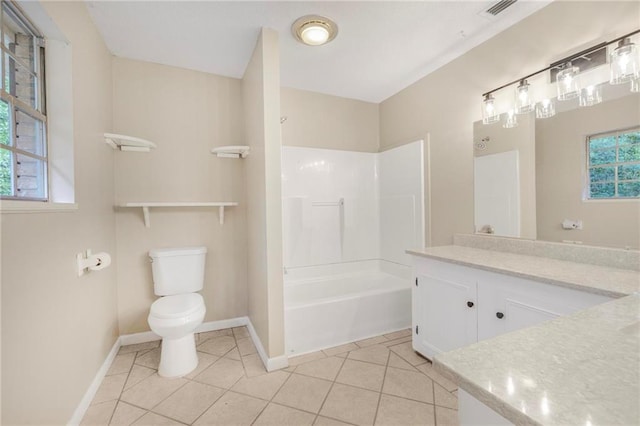 bathroom featuring tile patterned flooring, vanity, toilet, baseboards, and bathing tub / shower combination