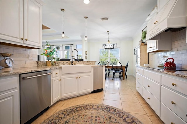 kitchen with pendant lighting, dishwasher, sink, tasteful backsplash, and white cabinetry