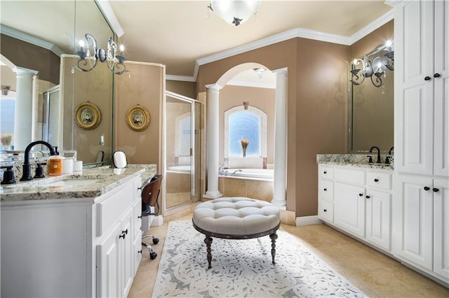 bathroom featuring tile patterned floors, vanity, ornate columns, and crown molding