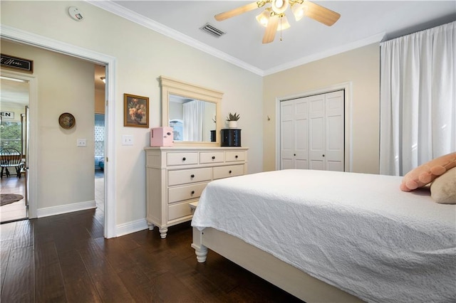 bedroom featuring a closet, ceiling fan, crown molding, and dark wood-type flooring